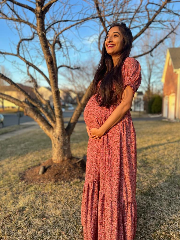 pregnant mom-to-be holding her baby bump